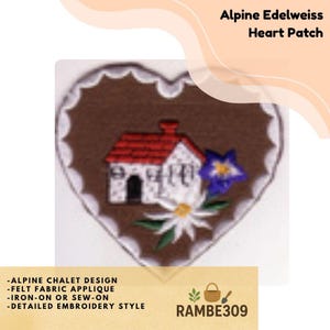 May include: A heart-shaped felt applique patch featuring an alpine chalet design. The patch has a brown border and a white scalloped edge. The design includes a house with a red roof, a blue flower, and a white daisy. The text "Alpine Edelweiss Heart Patch" is at the top.