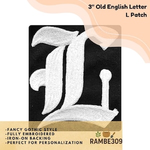 May include: A 3-inch Old English letter "L" patch with a fancy gothic style. The white embroidered letter is on a black background. The patch has an iron-on backing and is perfect for personalization.