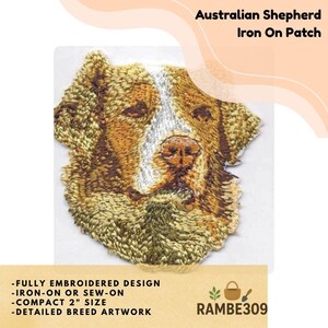 May include: Embroidered iron-on patch featuring an Australian Shepherd dog. The patch is a detailed artwork of the dog's face, with brown, white, and tan colors. The patch is approximately 2 inches in size. The text on the patch says "Australian Shepherd Iron On Patch".