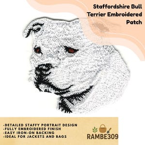 May include: Embroidered patch featuring a detailed portrait of a Staffordshire Bull Terrier. The patch is white with black and brown accents, and includes the text "Staffordshire Bull Terrier Embroidered Patch". The patch also has the text "-DETAILED STAFFY PORTRAIT DESIGN -FULLY EMBROIDERED FINISH -EASY IRON-ON BACKING".