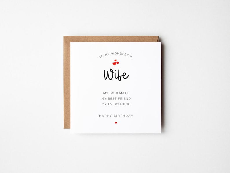 May include: A white card with a brown envelope, featuring the text "TO MY WONDERFUL Wife" with red heart details. The card also includes the phrases "MY SOULMATE, MY BEST FRIEND, MY EVERYTHING, HAPPY BIRTHDAY."