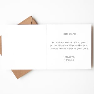 May include: A white greeting card with text, and a brown envelope on a white background. The card's text reads "Hello there!" and provides a preview of a personalized message. The card is from "Tarchies."