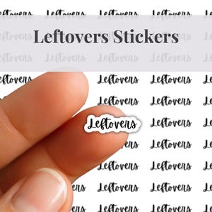 May include: A sheet of white adhesive labels featuring the word Leftovers printed in a black cursive script. One individual sticker is held up, displaying the same black cursive text on a white background with a die-cut border shape.