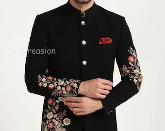 Könnte beinhalten: Schwarzer Blazer mit floralen Stickereien an den Ärmeln und einem roten Einstecktuch. Der Blazer hat einen Stehkragen und silberne Knöpfe. Der Text "URcreasion" ist auf der linken Seite sichtbar.