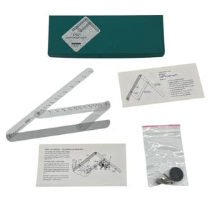 May include: A clear plastic PS pantograph drawing tool, partially assembled, with a green box and instruction sheets. The tool is designed for enlarging or reducing drawings. Includes a small bag with hardware.