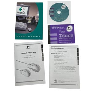 May include: A collection of Logitech computer accessories and documentation. Includes a CD, user guides, and a registration card. The packaging features the Logitech logo and the tagline "It's what you touch."
