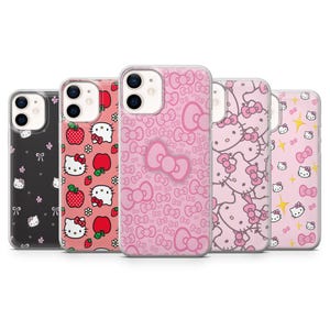 May include: A collection of phone cases featuring Hello Kitty designs. The cases showcase various patterns, including bows, strawberries, and the iconic character. Colors include pink, black, and red.