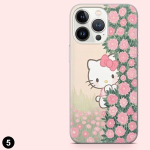 May include: Clear phone case featuring a Hello Kitty design peeking from behind a cluster of pink roses. The case has a light pink background with a floral pattern and a clear border.