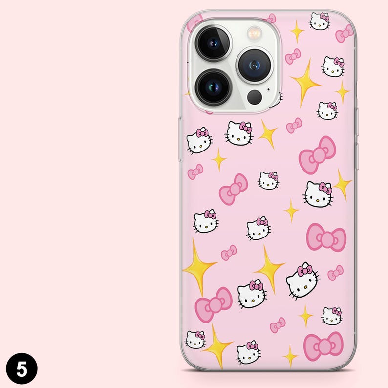 May include: Pink phone case featuring a repeating pattern of Hello Kitty faces, pink bows, and yellow starbursts. The case has a clear border and covers the back and sides of the phone. The phone case is designed for a smartphone.