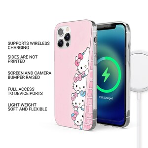 May include: Pink phone case featuring a Hello Kitty design with three characters and bows. The case is shown next to a phone with a charging screen. The case supports wireless charging and has full access to device ports.