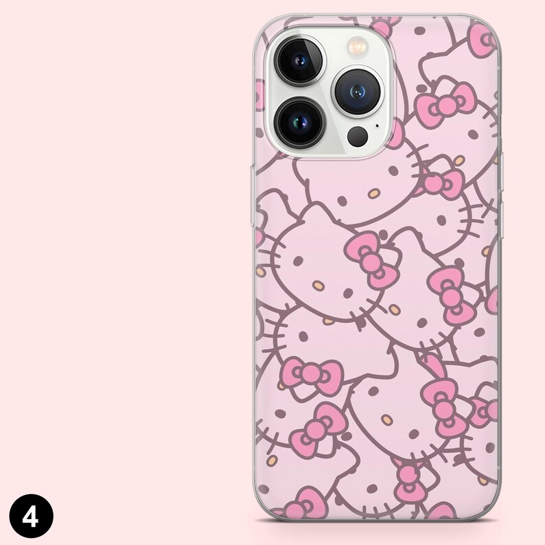 May include: A pink phone case featuring a repeating pattern of Hello Kitty faces with pink bows. The case has a clear border and a camera cutout. The background is a solid light pink color.