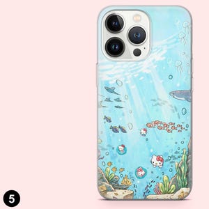 May include: A clear phone case featuring an underwater scene with cartoon fish, sharks, and Hello Kitty characters. The design is in shades of blue and green, with light rays shining through the water. The case has a glossy finish.