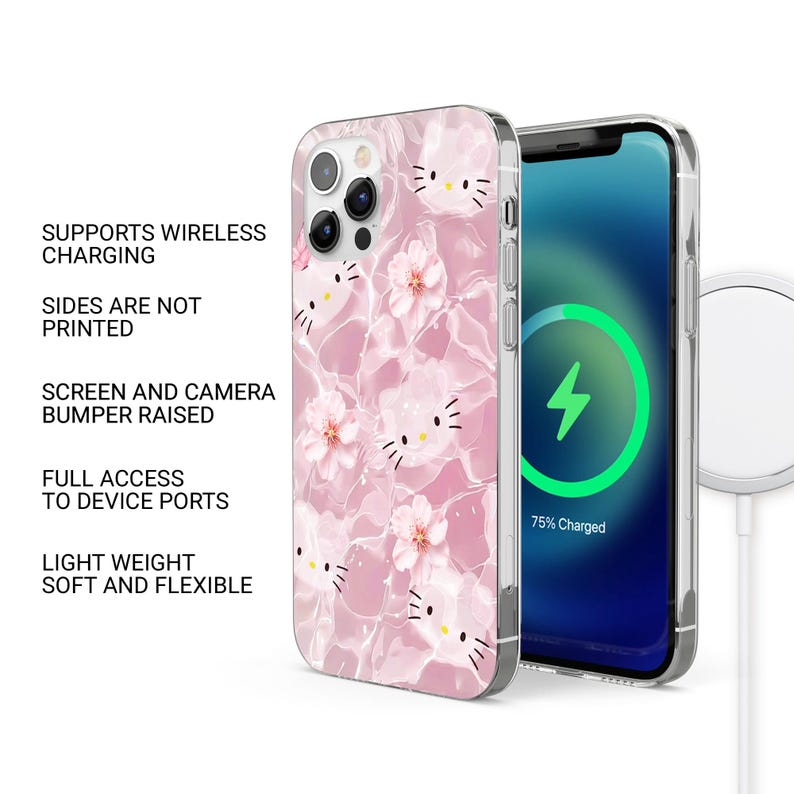 May include: A pink phone case with a repeating pattern of a cartoon cat face and flowers. The phone case is on a phone with a charging symbol on the screen. The case supports wireless charging and has full access to device ports.