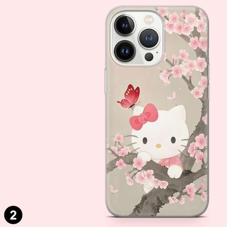 May include: Clear phone case with a Hello Kitty design. The case features Hello Kitty in a pink outfit, a pink bow, and a red butterfly, set against a backdrop of cherry blossoms. The case has a clear border.