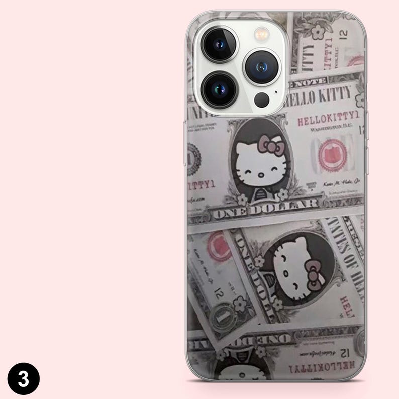 May include: Clear phone case featuring a design of dollar bills with Hello Kitty illustrations. The case has a clear border and covers the back and sides of the phone. The design includes the text "HELLO KITTY".
