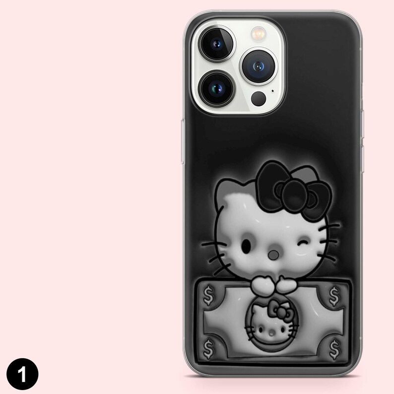 May include: Black iPhone case with a 3D embossed Hello Kitty design. The design includes a bow, winking eye, and a dollar bill with Hello Kitty's face. The case has a clear border and is made of a durable material.
