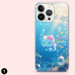 May include: A clear phone case featuring a cartoon Hello Kitty character wearing a diving mask and surrounded by colorful fish and bubbles in an underwater scene. The design includes a pink bow and a blue and white color scheme.