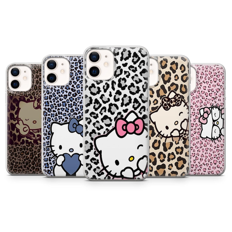 May include: A collection of five phone cases featuring Hello Kitty designs. The cases showcase various patterns, including leopard print and Hello Kitty illustrations with bows and hearts. The cases are in shades of brown, blue, pink, and white.