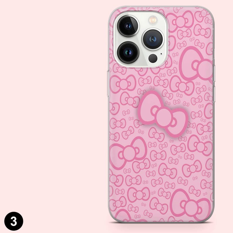 May include: Pink phone case with a repeating bow pattern and a large bow accent. The case is designed to fit a smartphone and has a clear border. The background is a solid light pink.