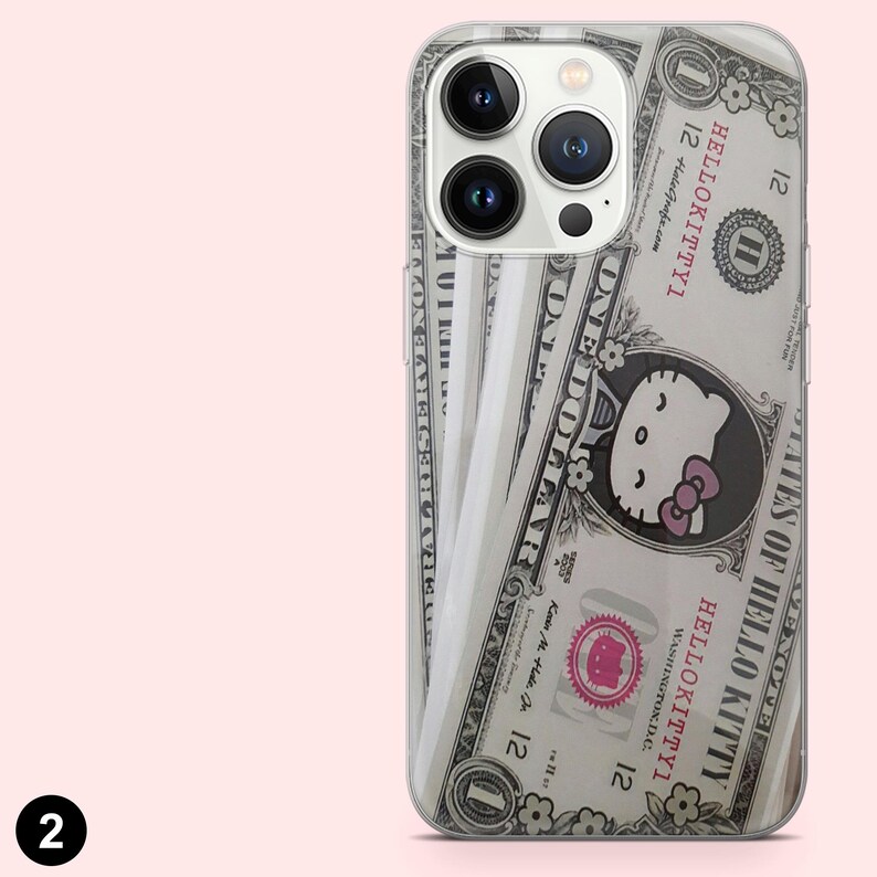 May include: Clear phone case featuring a design that mimics a one-dollar bill, with the Hello Kitty character replacing George Washington. The case has a pink bow and the text "HELLO KITTYI". The phone case is designed to fit a smartphone.