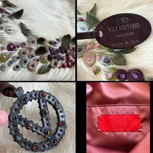 May include: Close-up of a white fur-like textile with floral embroidery in shades of green, pink, and purple. A brown leather tag with "VALENTINO GARAVANI MADE IN ITALY" is visible. A silver pendant with colorful gemstones is also shown.