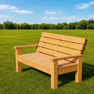 May include: A light brown wooden bench featuring a slatted backrest, a flat seat composed of horizontal planks, and two armrests. The bench is constructed with four sturdy square legs and has a natural wood grain finish throughout the structure.