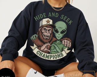 Gildan Sweatshirt Hide and Seek Champions Shirt | Bigfoot Alien Tee | Cryptid Funny Humor | Sasquatch UFO Gift | Hiking Funny UFO Shirt