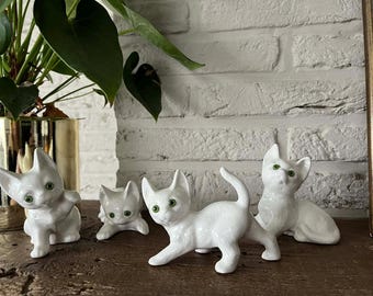 Set of 4 vintage ceramic cats with green glass eyes