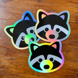 Holografische wasbeer sticker