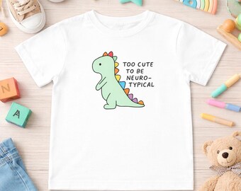 Camiseta infantil con estampado de dinosaurios arcoíris, para concienciar sobre el autismo, cómoda y ajustada.
