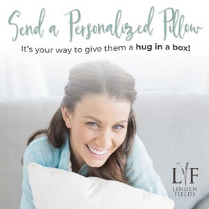 May include: A woman smiles while holding a white pillow. The text "Send a Personalized Pillow" and "It's your way to give them a hug in a box!" is above her. The logo "LYF LINDEN FIELDS" is in the bottom right corner.