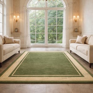 May include: A green rectangular rug with a cream border is centered in a room with cream-colored sofas, a large window, and a chandelier. The rug's dimensions are not visible in the image.