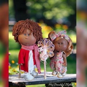 May include: A set of three ceramic nesting bowls in shades of blue, green, and white. The bowls feature a speckled glaze and a simple, modern design. The largest bowl measures approximately 6 inches in diameter.