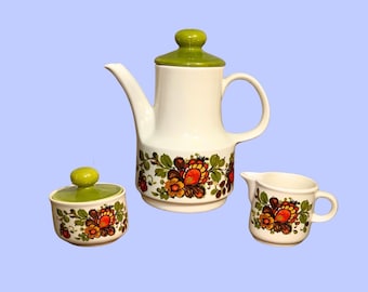Servizio da caffè vintage anni '70, set di 3 pezzi in ceramica con motivo floreale verde e arancione e disegno paisley.