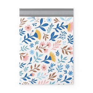 May include: White poly mailer featuring a colorful floral pattern. The design includes blue, yellow, pink, and brown flowers and leaves. The top edge has a gray strip for sealing. Ideal for shipping small items.