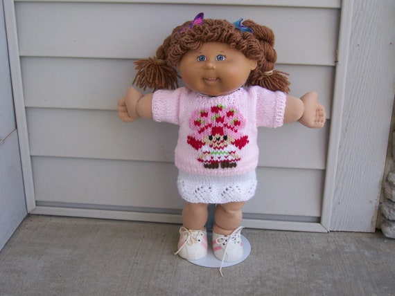 A Crew Neck Sweater with an embroider on Short Sleeves Back Closure Hand Knit Dolls Toys Doll Clothes CPK's American Girl Bitty Baby etc