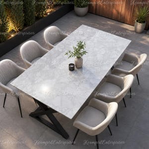 May include: A rectangular dining table with a light gray marble-patterned top and a black metal X-shaped base, surrounded by six light gray upholstered armchairs with vertical stitching on the backrests and thin black metal legs.