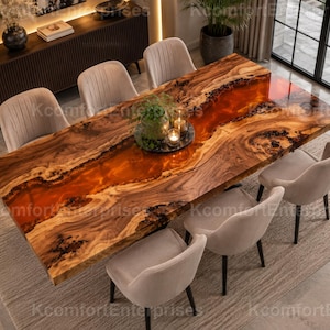 May include: A rectangular dining table featuring a live-edge wood slab with a central translucent orange resin river inlay, paired with six upholstered light beige chairs with dark legs, arranged around the table on a textured area rug.