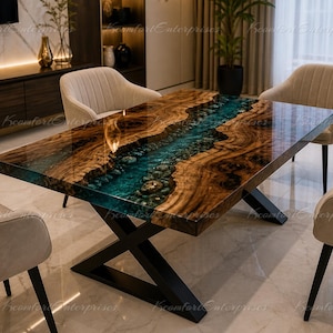 May include: A rectangular wooden dining table with a river-like design in the center. The table features a dark wood grain with a teal epoxy resin river. The table is supported by a black metal X-shaped base. Four beige upholstered chairs surround the table.