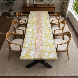 May include: A rectangular dining table with a white and yellow stone mosaic top featuring a central pink stone inlay, supported by a black metal X-shaped base, surrounded by eight wooden chairs with curved backrests and white upholstered seats.