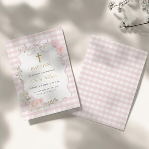 May include: Pink and white gingham baptism invitation with floral accents and a gold cross. The invitation includes the text "BAPTISM" and details for Olivia Wilson's baptism. A matching blank card is also shown.