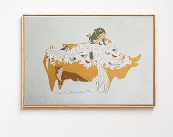 May include: A framed art print featuring a stylized illustration of a rhino. The rhino is primarily ochre with white and blue accents, and a small bird perched on its back. The artwork is signed in the lower portion.