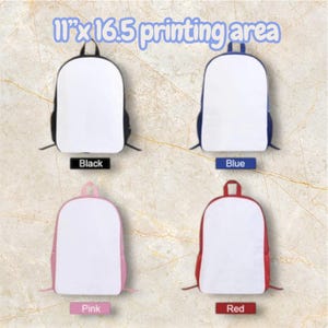 May include: Four backpacks in black, blue, pink, and red. Each backpack has a white front panel and a colored trim. The text "11" x 16.5 printing area" is at the top. Each backpack has a label with its color.