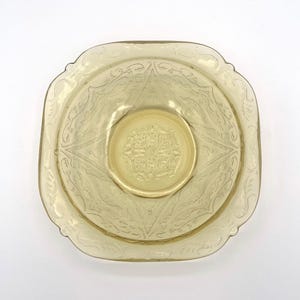 May include: A set of three ceramic mugs with a speckled, matte finish. The mugs are in shades of cream, light gray, and dark gray. Each mug has a simple, minimalist design, perfect for coffee or tea.