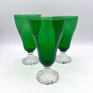 May include: A rustic wooden sign with the text "Welcome to our home" in white lettering. The sign features a distressed finish and a simple, inviting design, perfect for entryway decor.