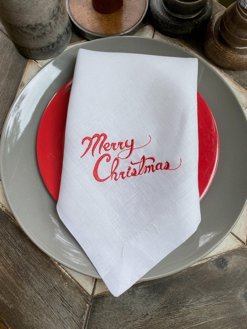 a white napkin with a merry christmas message on it