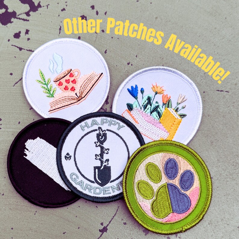 May include: A collection of embroidered patches with various designs. One patch features a cup of tea and a book, another has flowers, and a third displays a paw print. The text "Other Patches Available!" is visible.