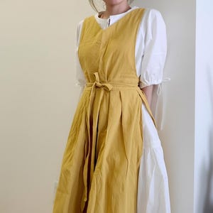 May include: A trio of ceramic mugs with a speckled, matte finish in cream, light grey, and dark grey. Each mug features a minimalist design and a rounded handle. Suitable for tea or coffee, these mugs offer a simple, modern aesthetic.