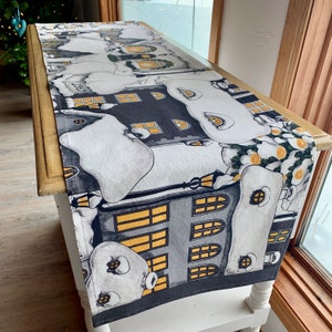 Swedish table runner in cotton print with snowy town and pine trees black white