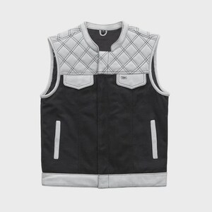May include: A black and gray vest with a quilted pattern on the shoulders and upper chest. The vest has two front pockets and a white trim along the edges. The vest is sleeveless and has a round collar.